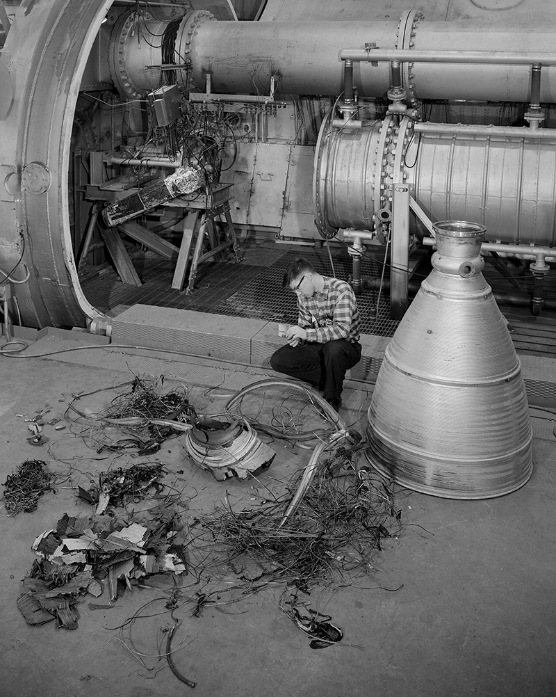 Man inspecting engine parts