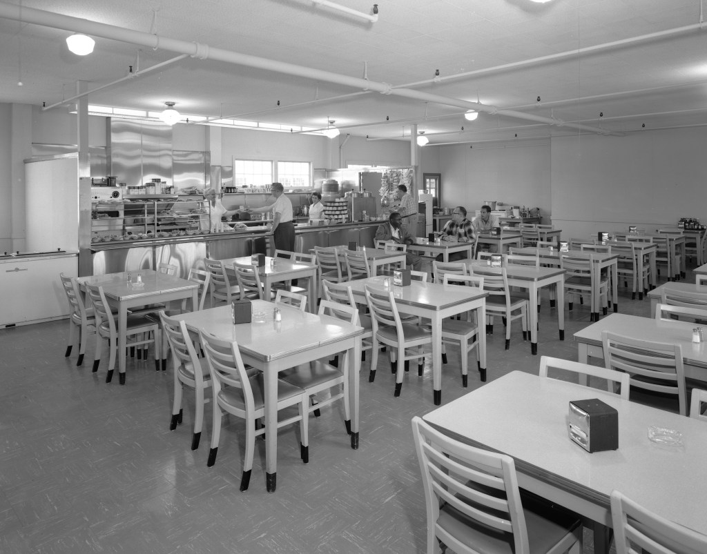 Tables and counter inside Cafeteria Building.