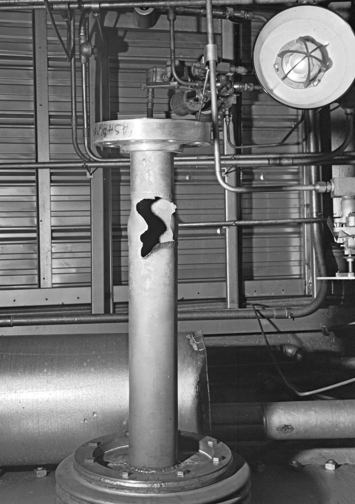 Vertical pipe with gash in it inside D Site.
