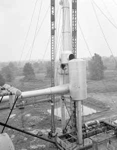 Crane lifting section of ejector into place.