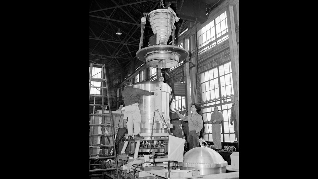 Mechanics in warehouse assemble nuclear engine