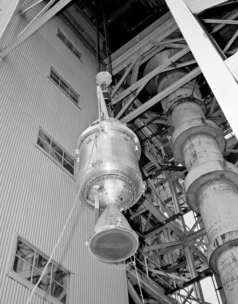 View up at Kiwi B engine as it is lifted into test stand