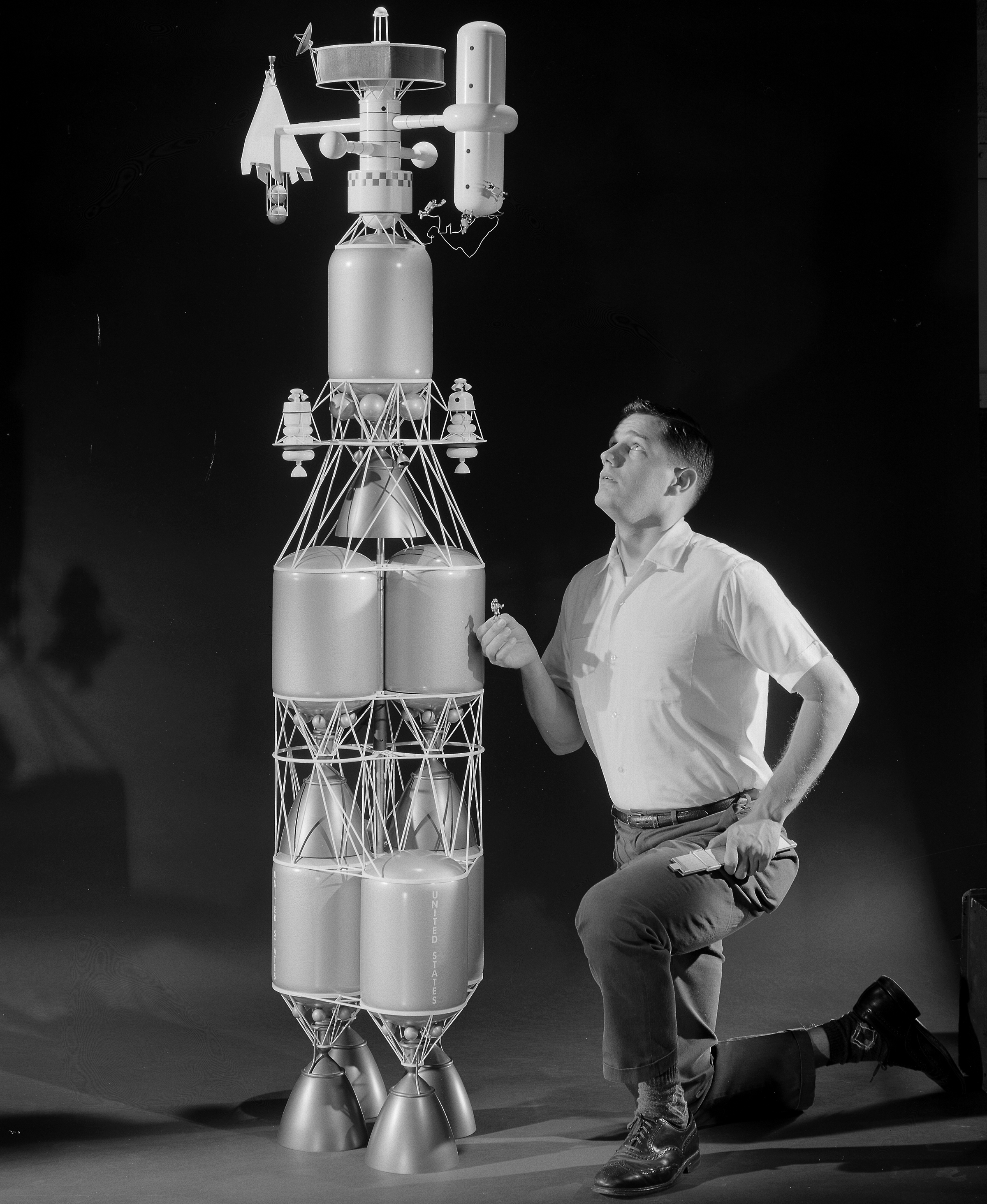 Researcher examines nuclear rocket model.