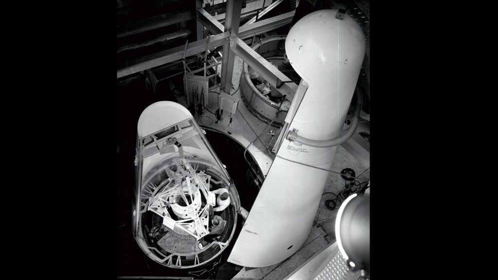 View inside rocket fairing mounted in E stand showing Surveyor replica