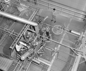 View from above as Technicians work on Mark IX turbopump for the Kiwi B-1B in the B-3 stand