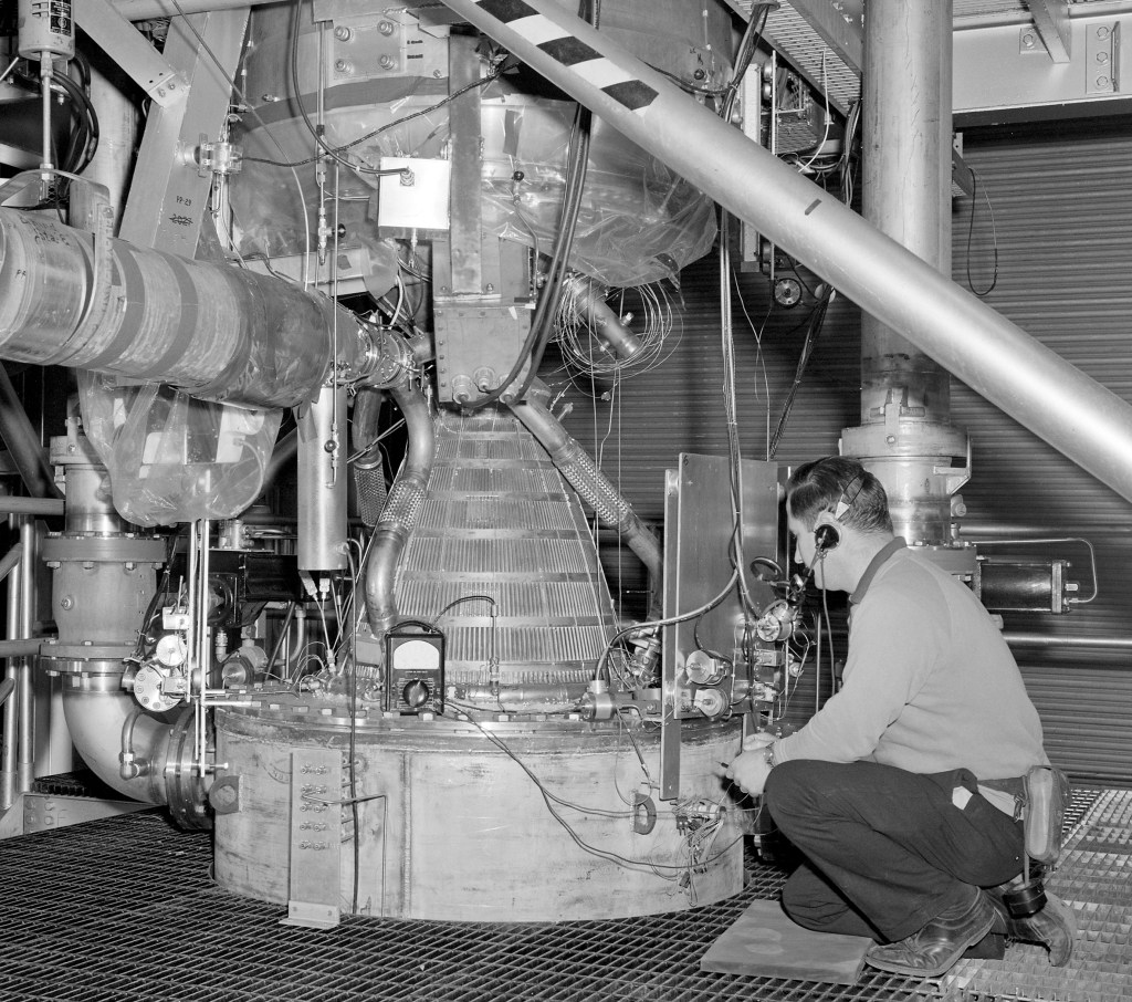 Technician with Kiwi engine in B-3 test section