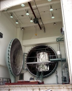 Round vacuum chamber with door open.