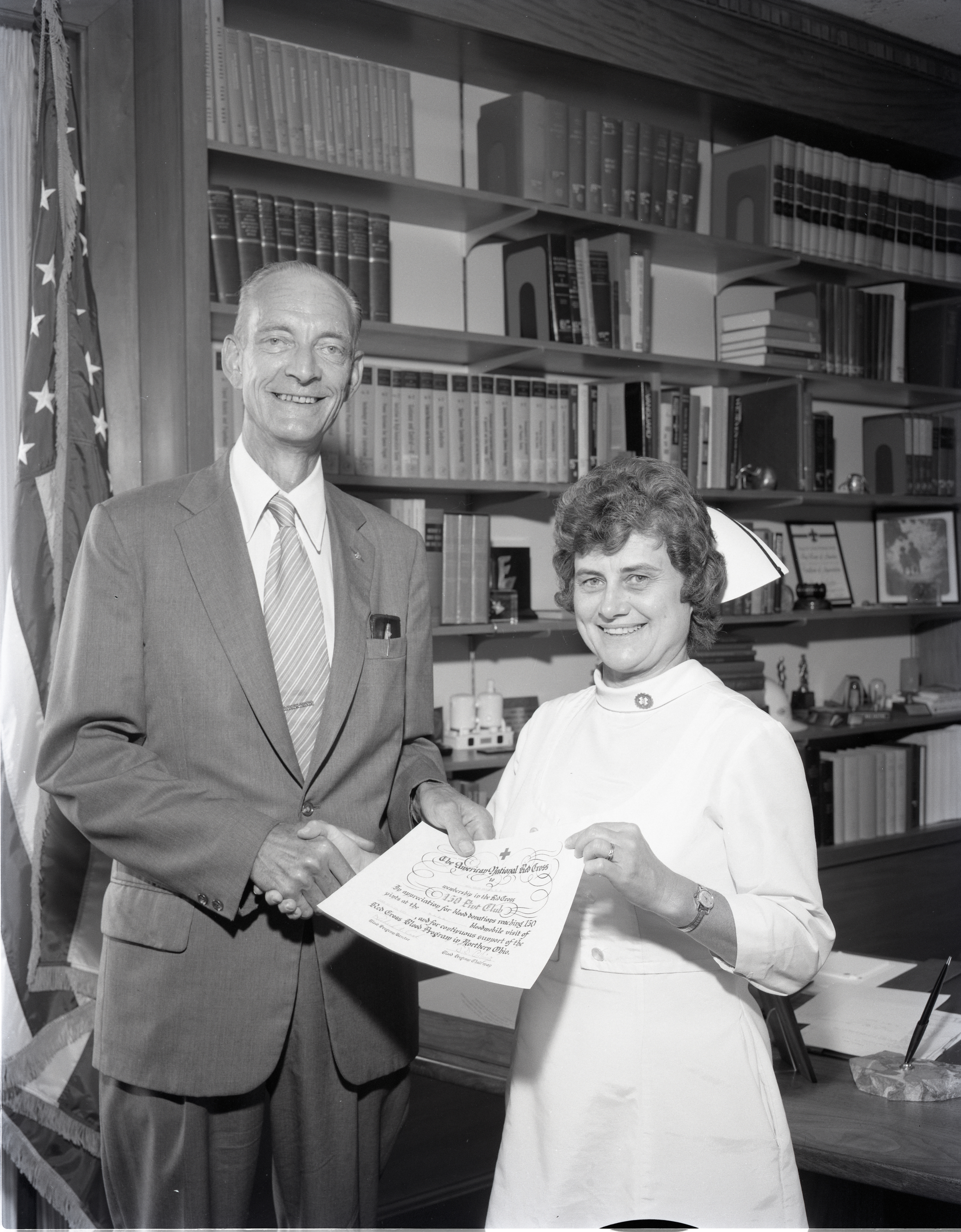 Man standing next to female nurse.