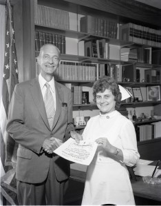 Man standing next to female nurse.