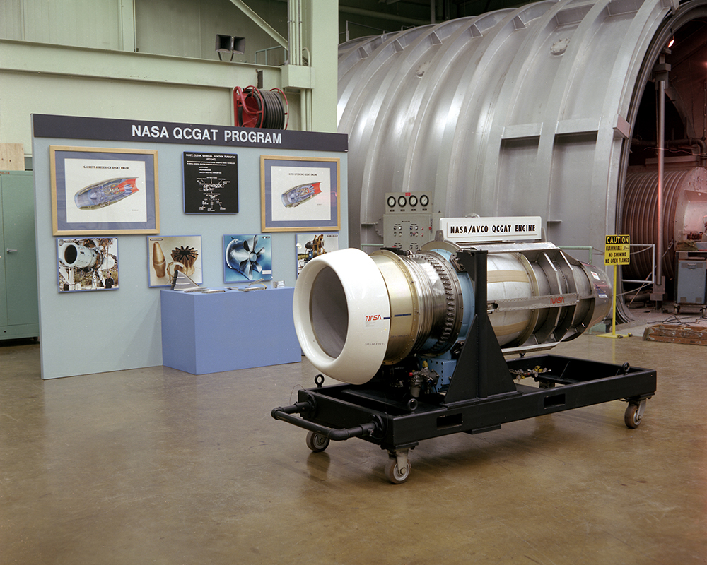 Engine on display in front of test cell.