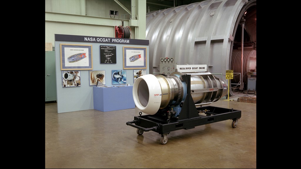 Engine on display in front of test cell.