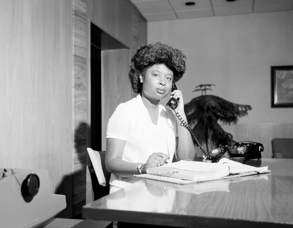 Woman sitting at desk.