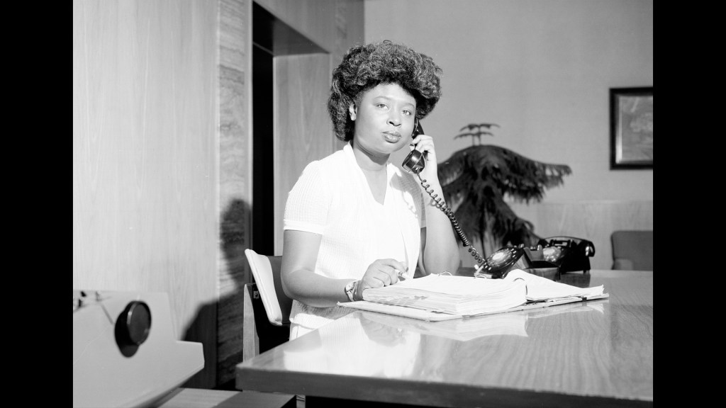 Woman sitting at desk.
