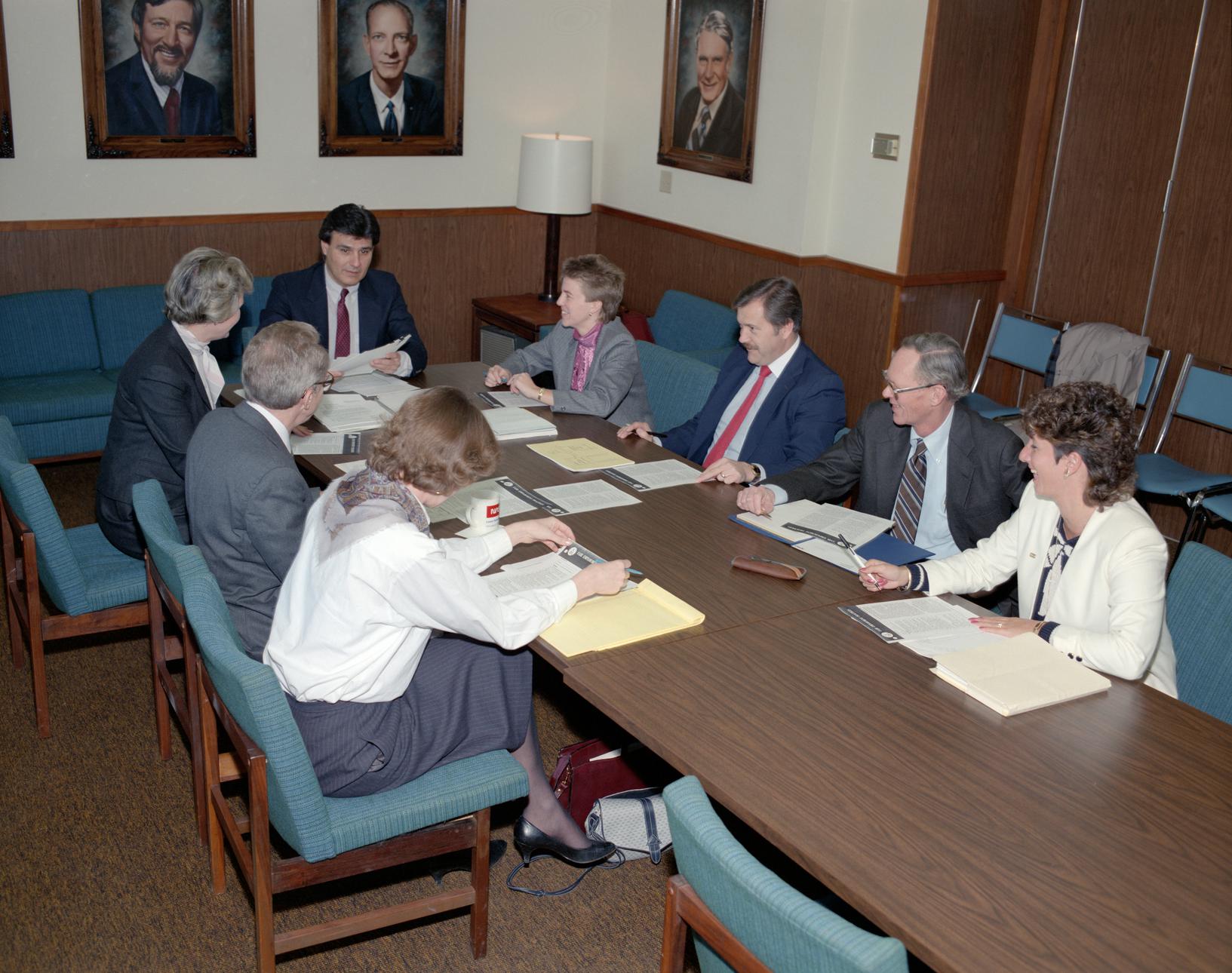 Group sitting at conference table.