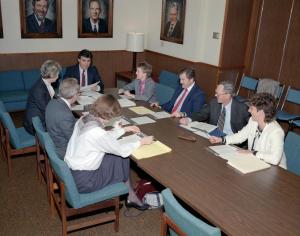 Group sitting at conference table.