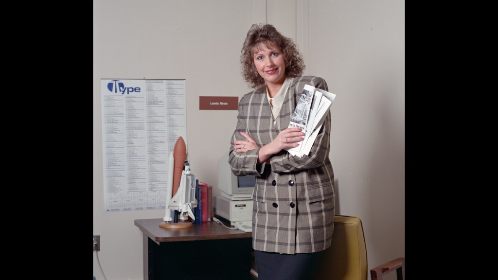 Woman standing in office.