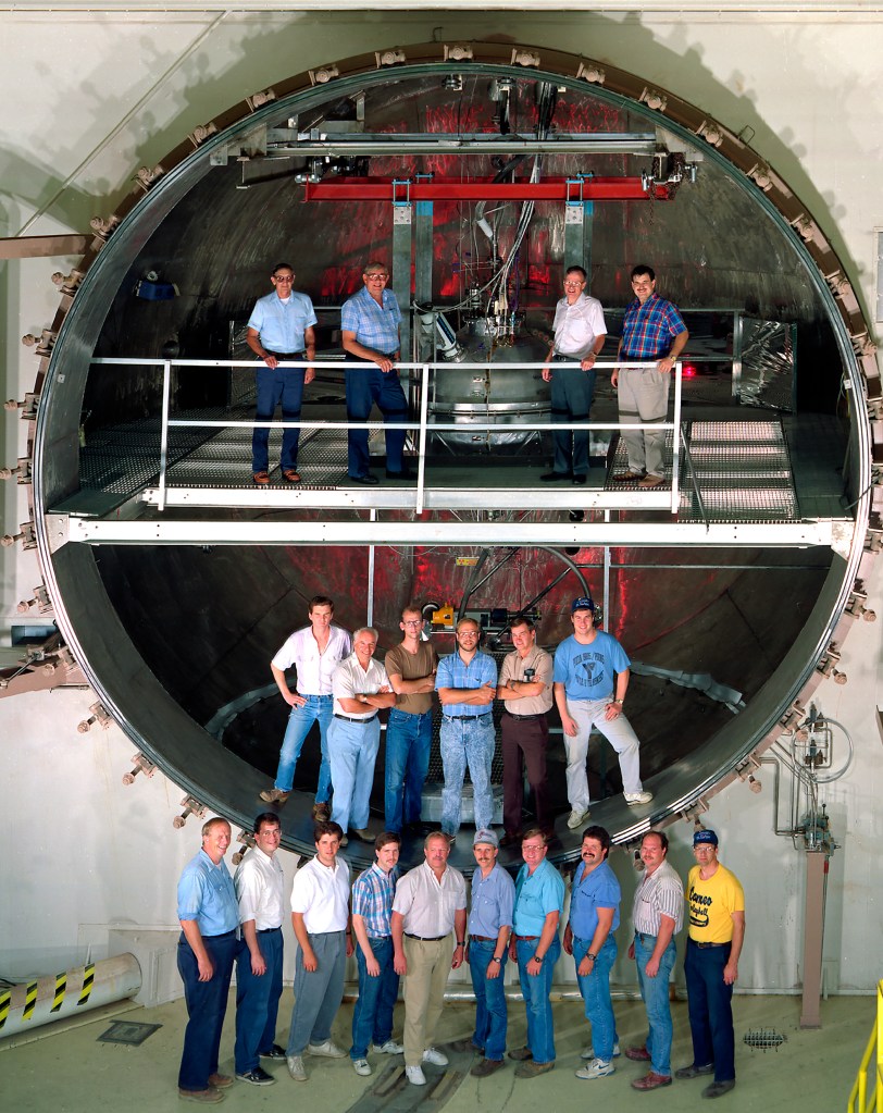 Employees pose in K Site chamber