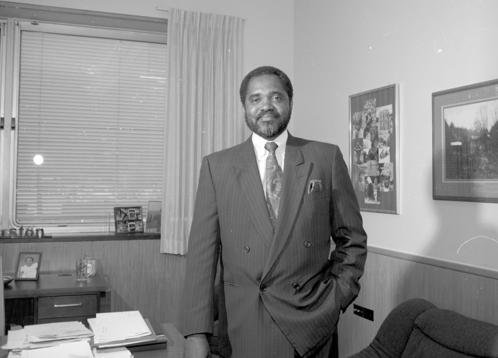Man standing in office.