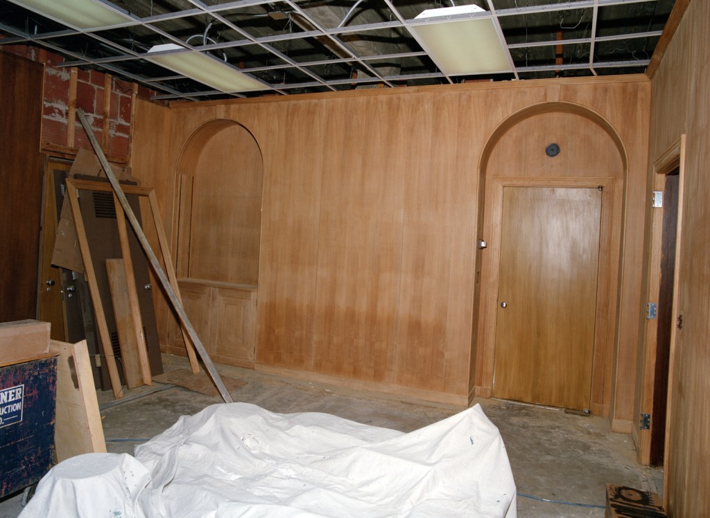 Paneled room under construction.