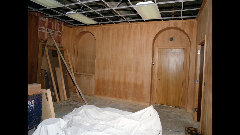 Paneled room under construction.