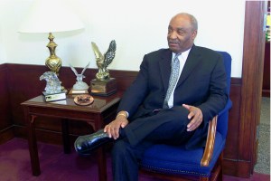 Man sitting in chair in office.
