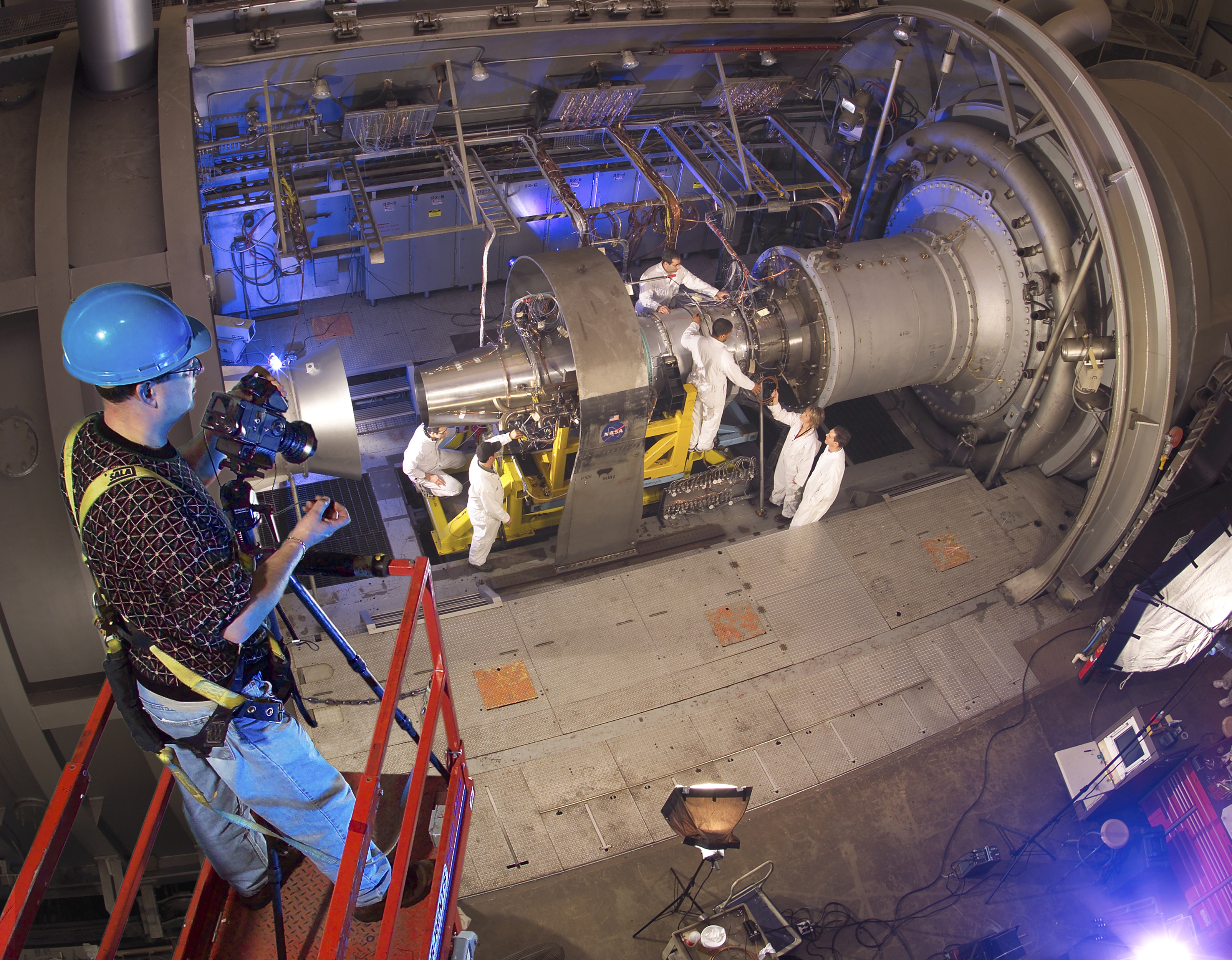 Photographer watches engine being set up