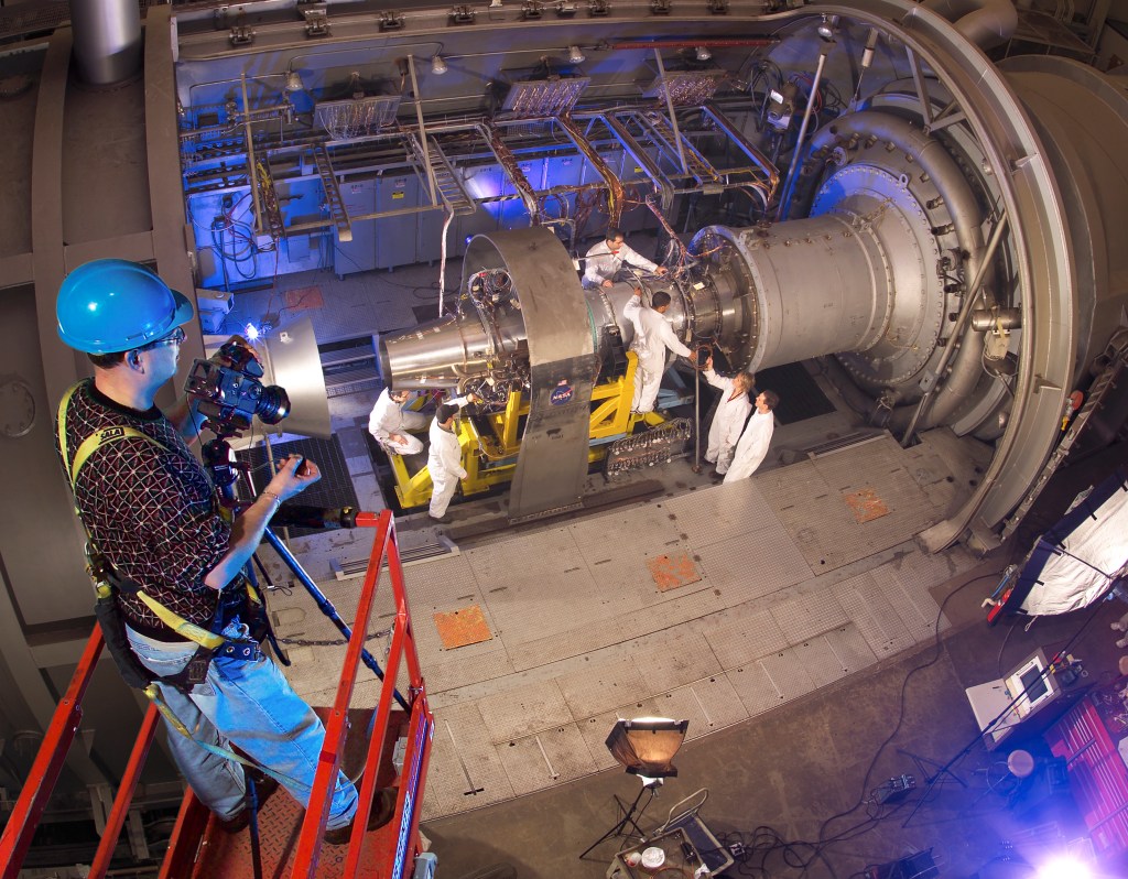Photographer watches engine being set up