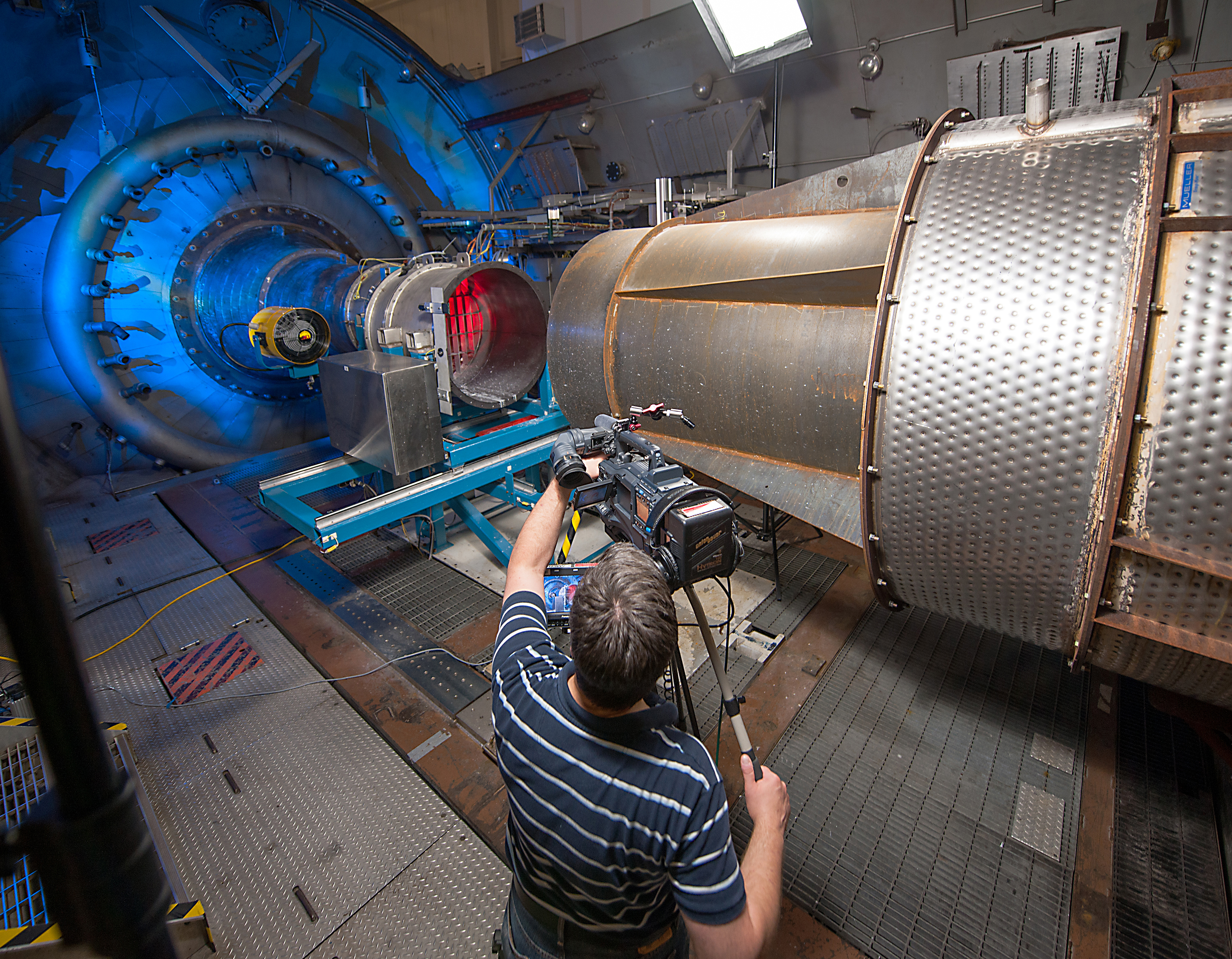 Photographer watches engine being set up