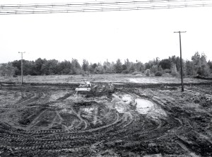 Tractor grades muddy field