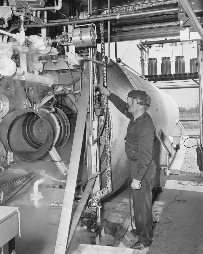 A mechanic inspects the test rig at I Site