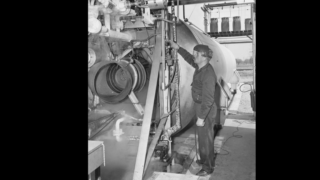 A mechanic inspects the test rig at I Site