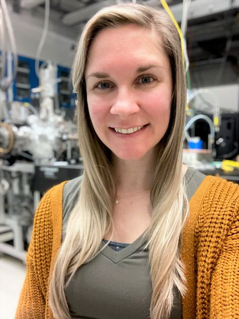 Picture of Katarina Yocum in a lab wearing a golden sweater.