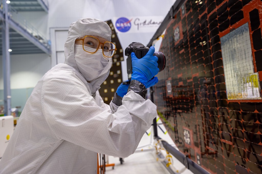 A photo of Laine in the big Goddard clean room