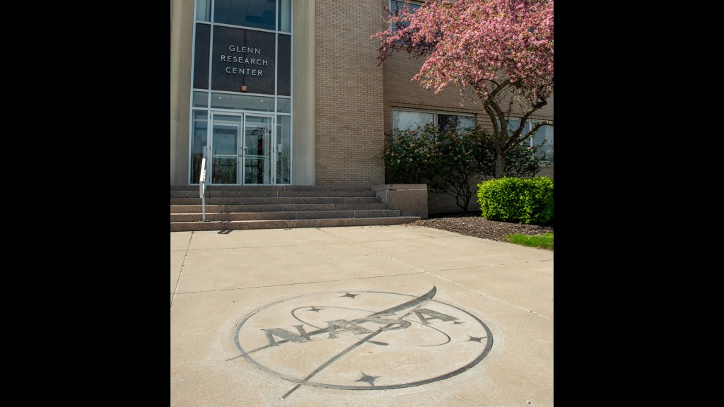 NASA insignia in concrete in front of building
