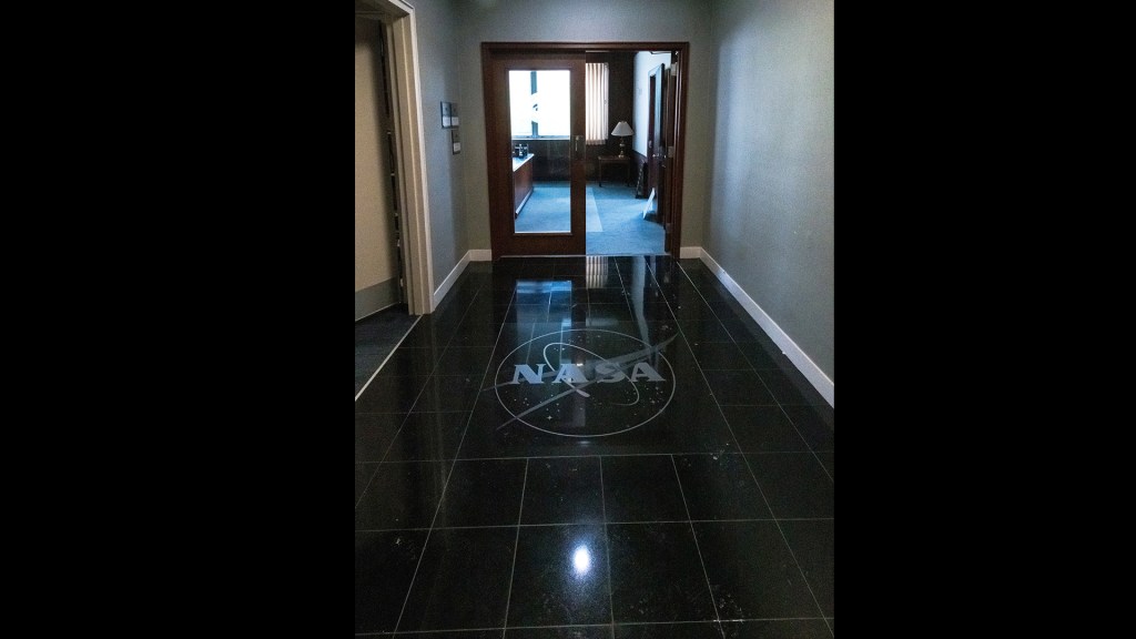 View down hallway and through glass doors.