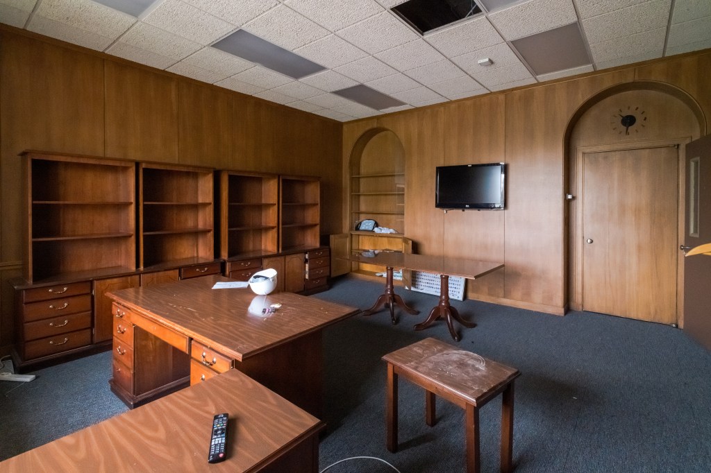 Wood-paneled office.