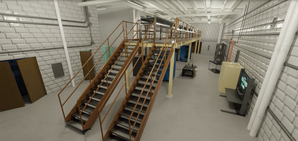Two metal flights of stairs  sit in a white, brick, windowless facility room.  Other equipment such as television sets, cabinets, and technology is lined up on the walls of the room.