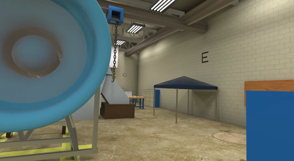 A large, blue dome, blue tent, and other equipment sit in a beige, brick facility room.