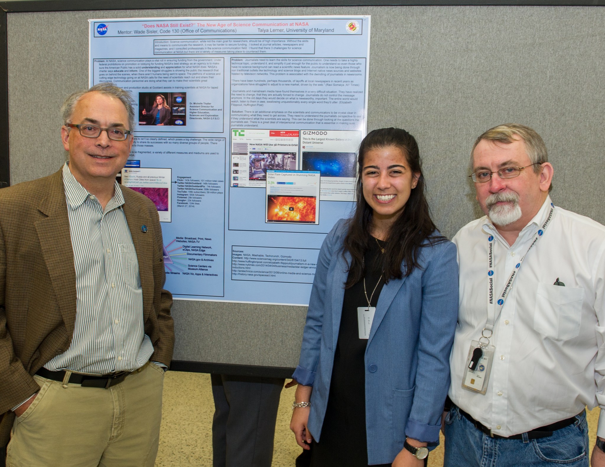 Wade and a student and another coworker at a poster session
