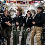 From left, NASA's SpaceX Crew-10 members Kirill Peskov of Roscosmos, NASA astronauts Nichole Ayers and Anne McClain, and JAXA (Japan Aerospace Exploration Agency) astronaut Takuya Onishi share a light moment during a group portrait inside the International Space Station's Kibo laboratory module.