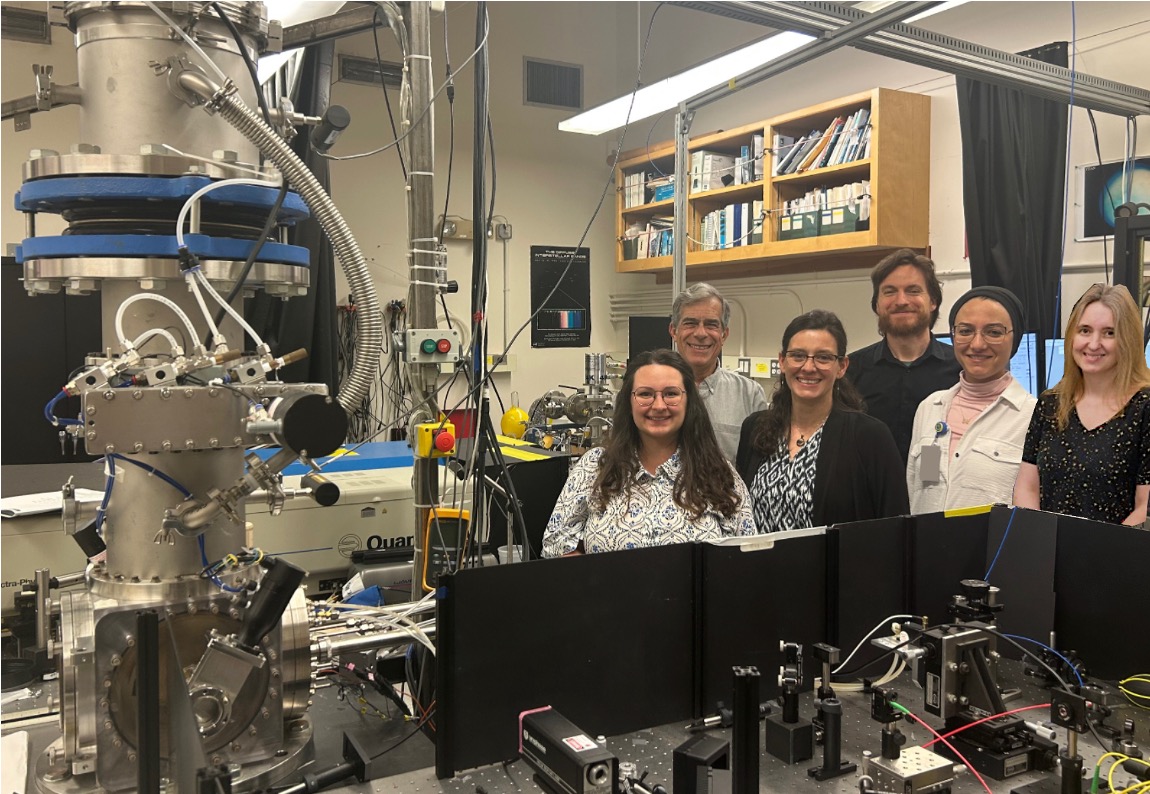 A photo of the COSMIC lab at NASA Ames Research Center. Pictured are, from left to right, Farid Salama with Lora Jovanovic, Ella Sciamma-O’Brien, David Dubois, Salma Bejaoui, and Claire Ricketts.