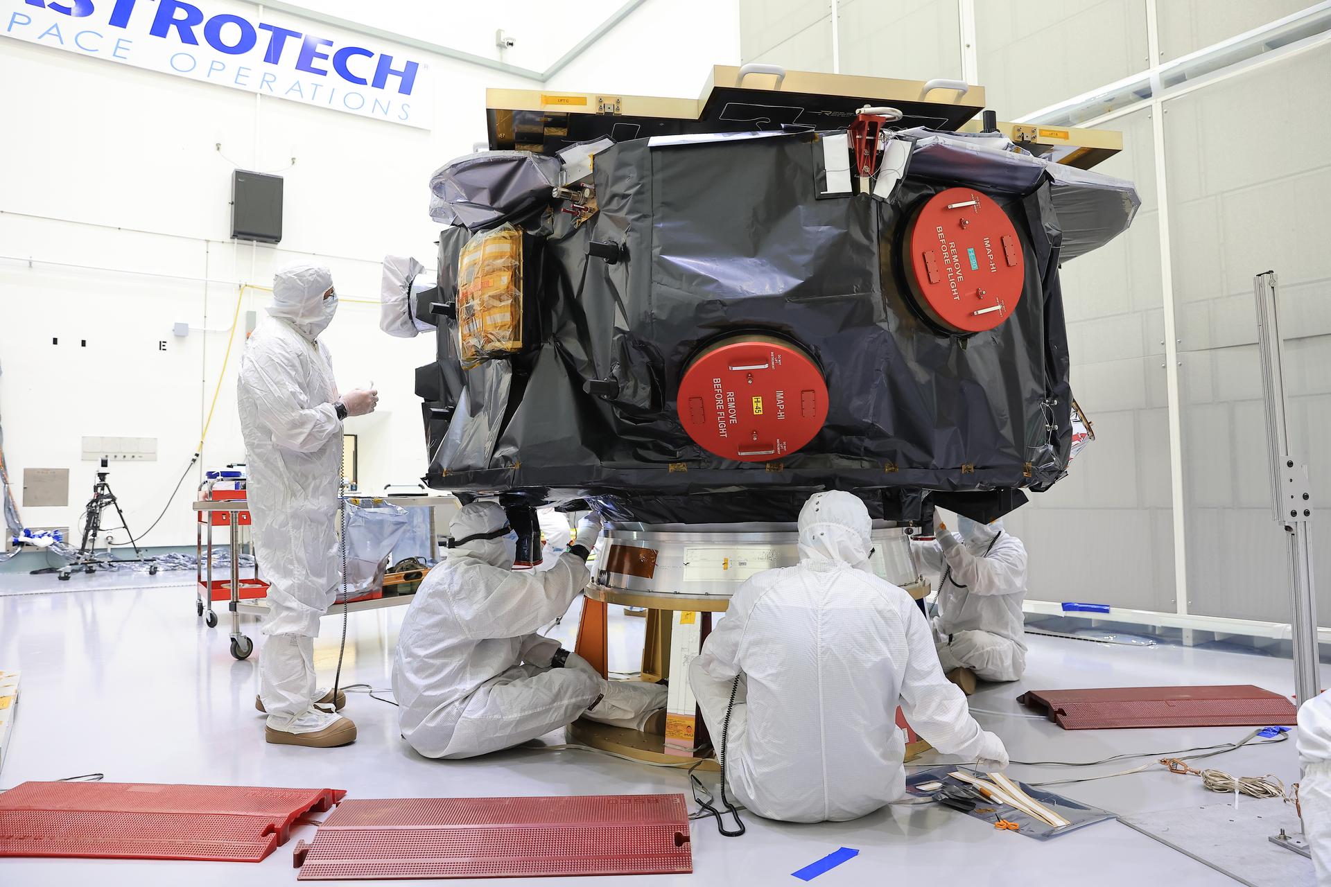 Technicians conduct blanket closeout work on NASA’s IMAP (Interstellar Mapping and Acceleration Probe) observatory at the Astrotech Space Operations Facility near NASA’s Kennedy Space Center in Florida on Friday, Aug. 15, 2025. The IMAP mission will explore and map the boundaries of the heliosphere — a huge bubble created by the Sun’s wind that encapsulates our entire solar system — and study how the heliosphere interacts with the local galactic neighborhood beyond.