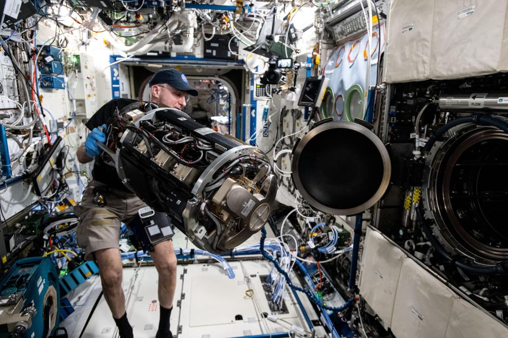 NASA astronaut and Expedition 72 Flight Engineer Don Pettit inserts research hardware into the Combustion Integrated Rack located inside the International Space Station's Destiny laboratory module. Pettit was configuring the SoFIE-MIST, or the Solid Fuel Ignition and Extinction - Material Ignition and Suppression Test, investigation that is exploring the flammability of materials in microgravity to improve spacecraft fire safety.