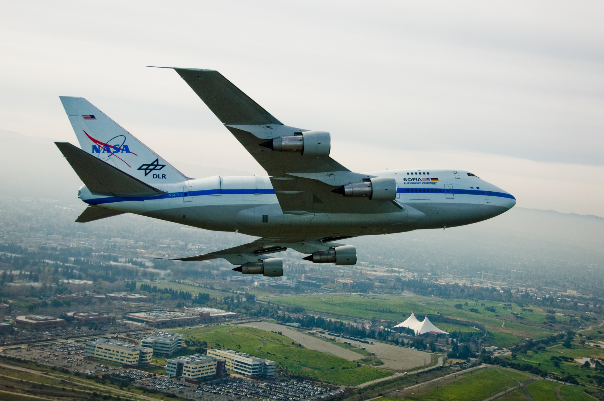 SOFIA in flight over a city