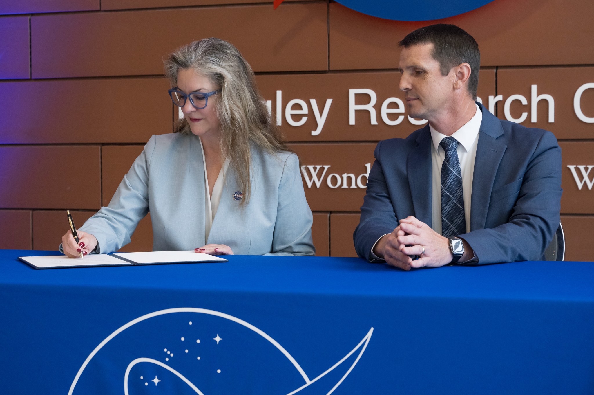 NASA’s Langley Research Center Acting Director Dr. Trina Marsh Dyal, left, and Dr. Jeremy Ernst, vice president for Research and Doctoral Programs at Embry-Riddle Aeronautical University, sign a Space Act Agreement during a ceremony held at NASA Langley in Hampton, Virginia on Thursday, Sept. 11, 2025.