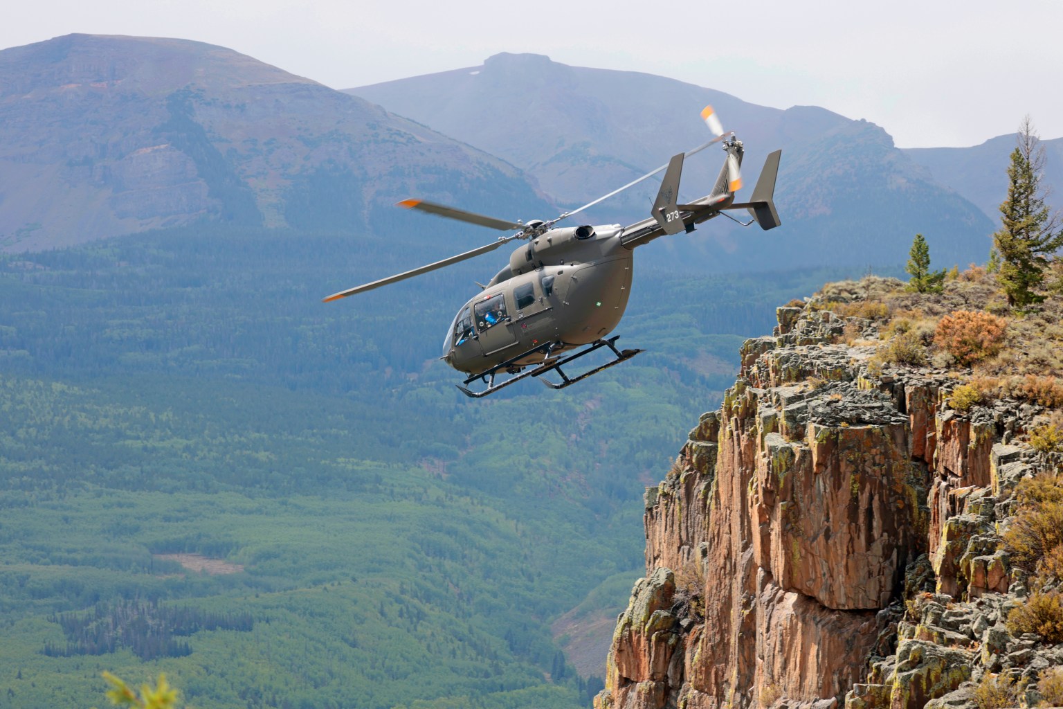 A LUH-72 Lakota helicopter flies over the mountains of northern Colorado Aug. 28 during a certification run for a lander flight training course for crewed Artemis missions. The mountains and valleys in Colorado have similar visual illusions to the Moon.