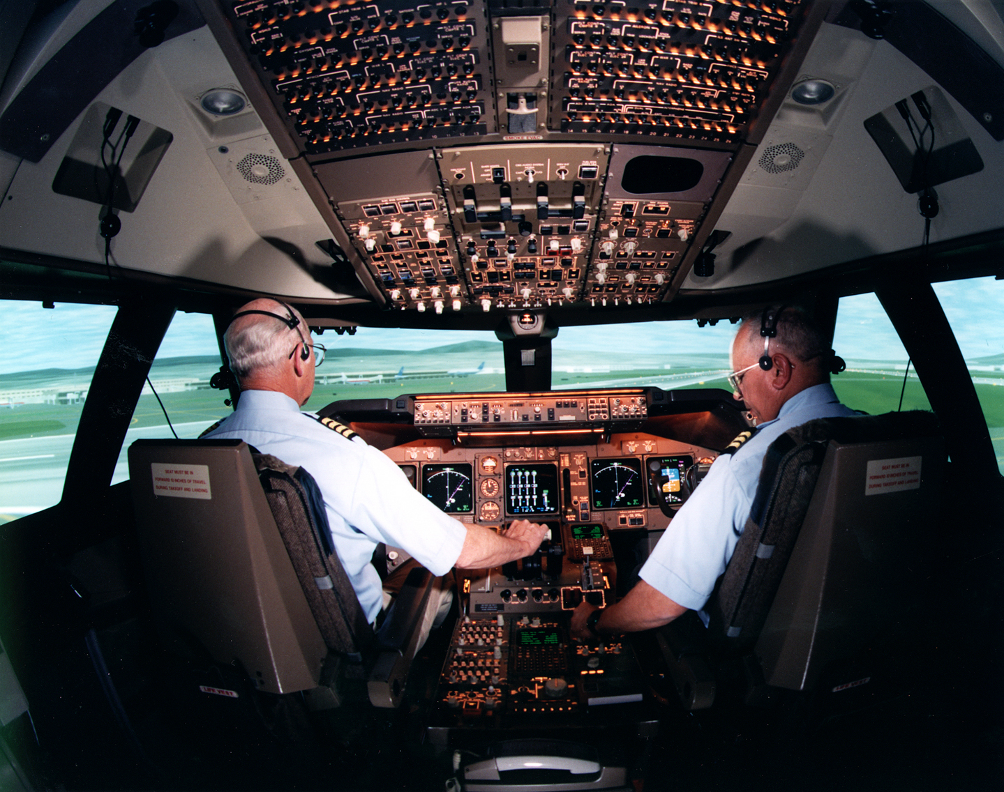 Image of two pilots in the cockpit of a Boeing 747 Simulator at NASA Ames Research Center.