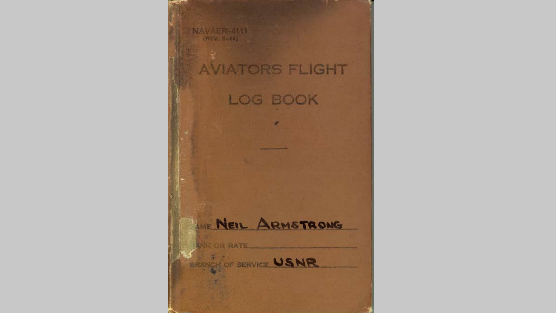 Brown cover of Neil Armstrong's Flight Log.
