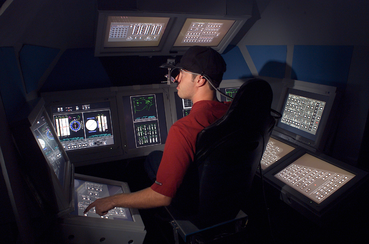 Image of a research subject inside a spaceflight simulator in Intelligent Spacecraft Interface Systems (ISIS) Lab at NASA Ames Research Center.