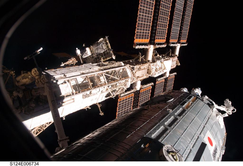 The Japanese Experiment Module, Kibo, is pictured attached to the International Space Station with black space in the background.